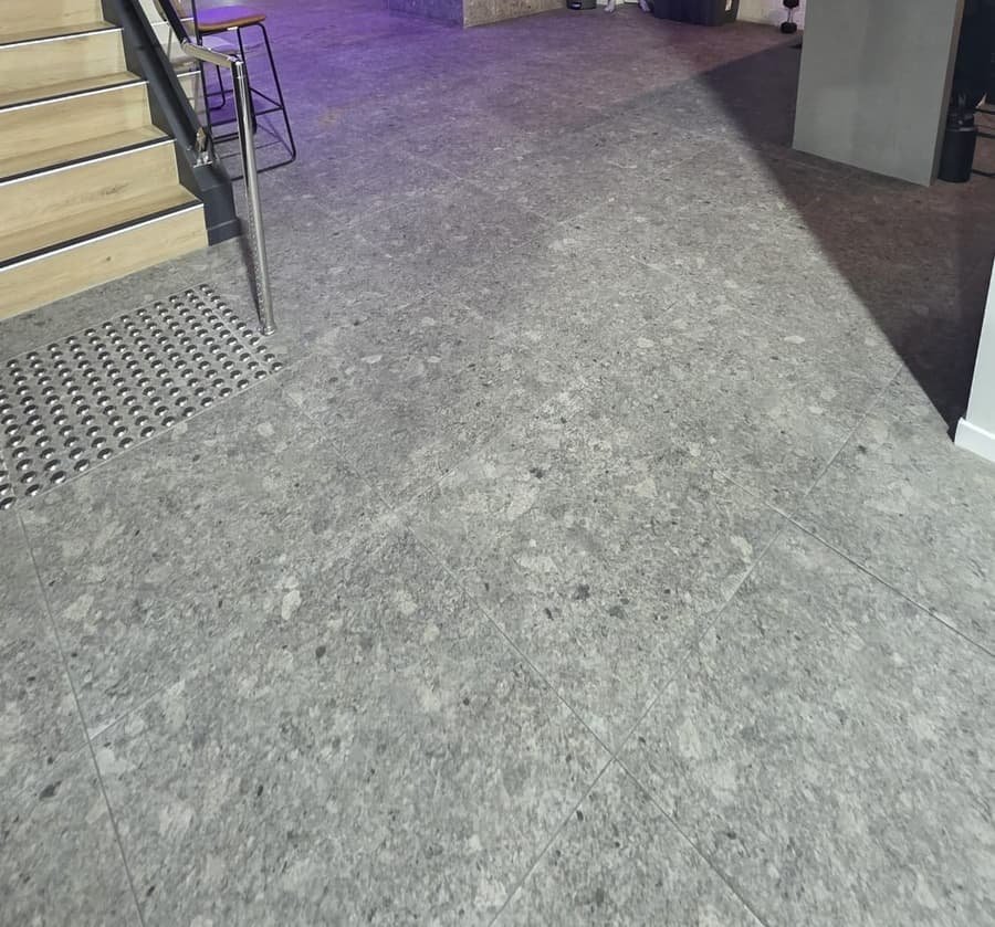 Fitness facility entrance floor after clean — polished and spotless