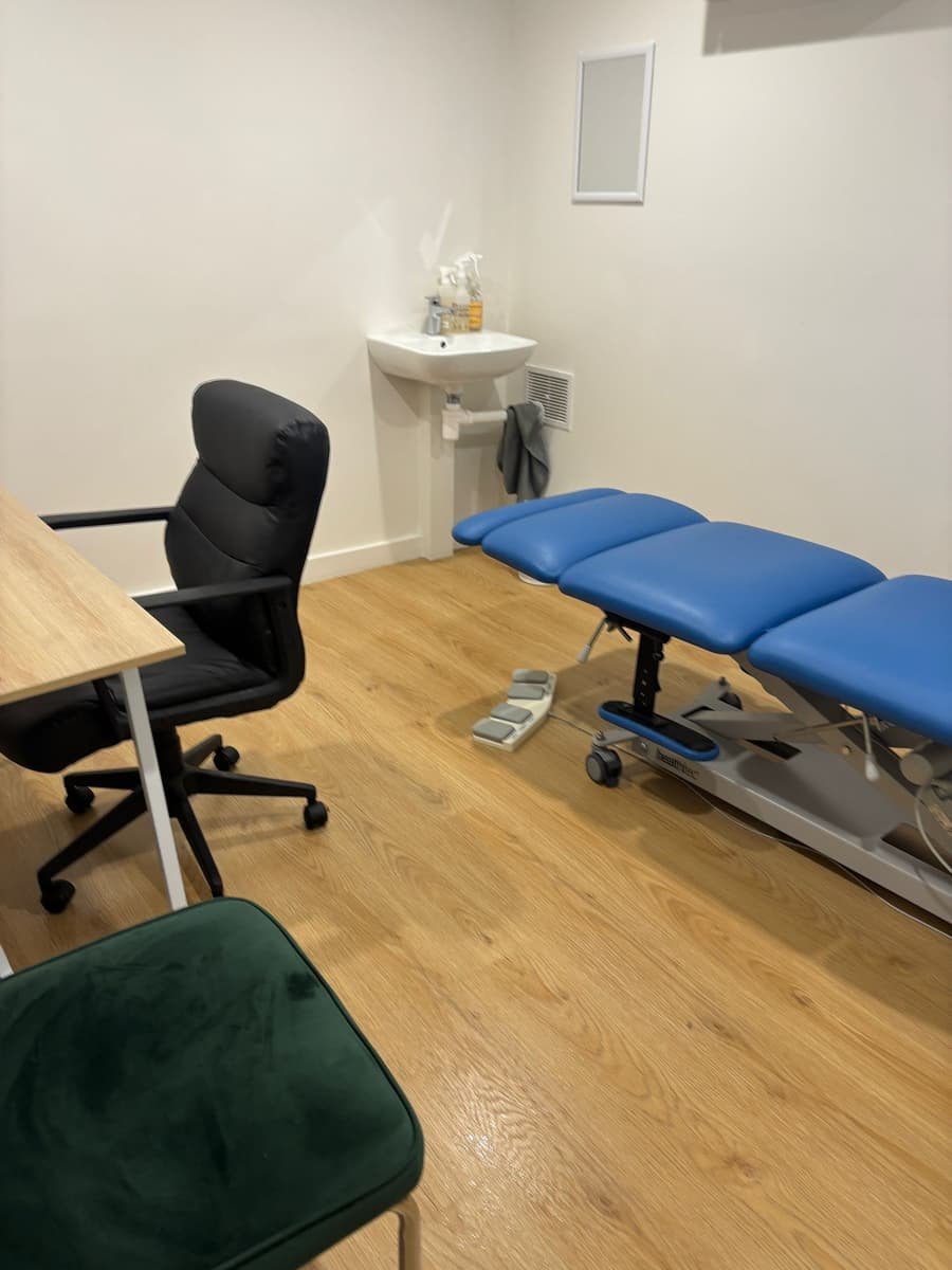 Medical treatment room after clean — spotless treatment table and floor